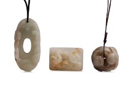 A GROUP OF THREE CELADON JADE CARVINGS (1)
