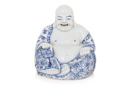 A BLUE AND WHITE PORCELAIN MODEL OF BUDAI