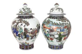 A PAIR OF FAMILLE ROSE PORCELAIN JARS WITH COVERS