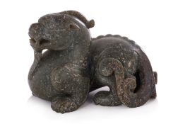 A JADE CARVING OF A MYTHICAL BEAST