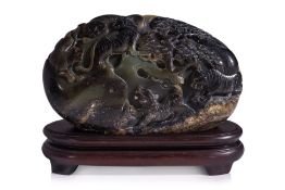A SMALL JADE BOULDER CARVING ON STAND