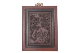 A FIGURAL CARVED HARDWOOD PANEL