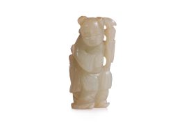 A CARVED CELADON JADE FIGURE