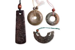 A GROUP OF FOUR ARCHAISTIC JADE CARVINGS