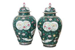 A PAIR OF LARGE BALUSTER FORM FAMILLE ROSE COVERED JARS