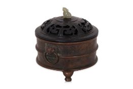 A BRONZE TRIPOD CENSER AND COVER
