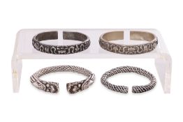 A GROUP OF FOUR CHINESE SILVER BANGLES