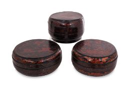 A GROUP OF THREE LACQUERED CIRCULAR BOXES AND COVERS
