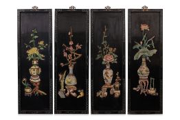 A SET OF FOUR BLACK LACQUERED PANELS
