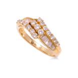A HIGH KARAT GOLD DIAMOND 'CROSSOVER' RING
