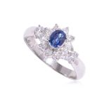 A SAPPHIRE AND DIAMOND RING