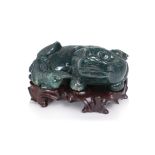 A DARK GREEN JASPER MODEL OF A LION AND CUB