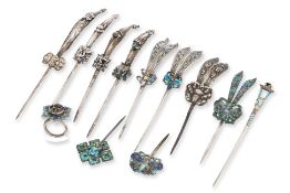 A GROUP OF ELEVEN ENAMELLED SILVER HAIRPINS AND A RING