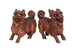 A PAIR OF CARVED BOXWOOD MODELS OF QILIN