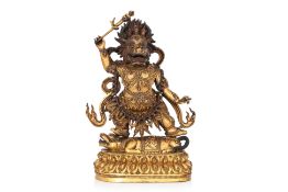A TIBETAN GILT-BRONZE MODEL OF YAMA