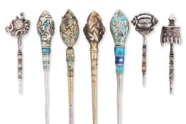 A GROUP OF SEVEN SILVER HAIRPINS
