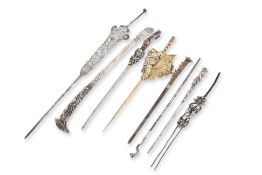 A GROUP OF EIGHT SILVER HAIRPINS