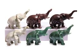 THREE PAIRS OF CARVED JADE AND HARDSTONE MODELS OF ELEPHANTS
