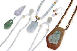 A GROUP OF EIGHT PIECES OF JADE JEWELLERY