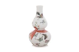 A FAMILLE ROSE BUTTERFLY DOUBLE GOURD VASE