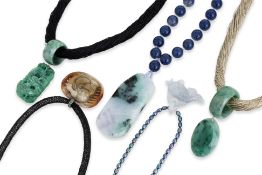 A GROUP OF FIVE JADE PENDANTS