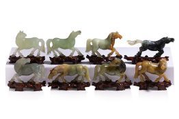 A SET OF EIGHT CARVED HARDSTONE MODELS OF HORSES