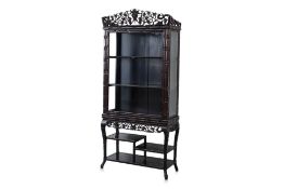 A CARVED BLACKWOOD DISPLAY CABINET