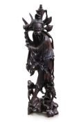 A VERY LARGE CHINESE CARVED HARDWOOD FIGURAL FLOOR LAMP