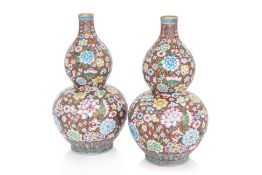 A PAIR OF FAMILLE ROSE MILLE-FLEURS DOUBLE GOURD VASES
