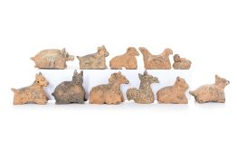A GROUP OF ELEVEN POTTERY ANIMALS