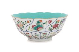 A FAMILLE ROSE MOULDED FOLIATE BOWL