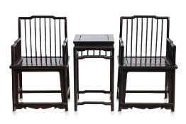 A PAIR OF RAIL BACK HARDWOOD ARMCHAIRS AND SIDE TABLE