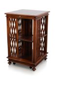 A FRENCH STYLE CHERRYWOOD REVOLVING BOOKCASE