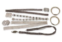 A GROUP OF SILVER AND BRASS JEWELLERY