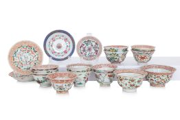 A GROUP OF FAMILLE ROSE TEA BOWLS AND SAUCERS