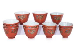 A GROUP OF 12 CORAL GROUND TEA BOWLS