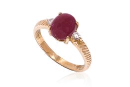 A RUBY AND DIAMOND THREE STONE RING