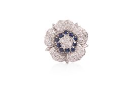 A DIAMOND AND SAPPHIRE 'FLOWER' PENDANT/BROOCH