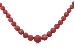 A GRADUATED CORAL STRAND NECKLACE