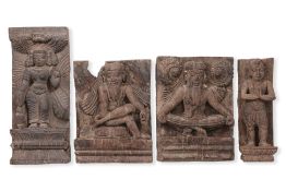 A GROUP OF FOUR INDIAN CARVED HARDWOOD PANELS
