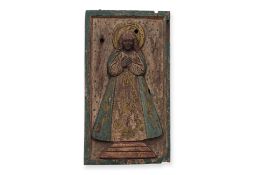 A LARGE CARVED PANEL OF THE VIRGIN MARY