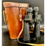 A pair of Barr & Stroud binoculars, marked 10x CF 47 model, British Patent no. 572537, in leather