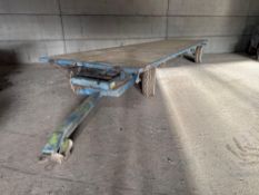 28ft flat bed 4-wheel trailer on 11.5/80-15 wheels and tyres. NB: Burst hydraulic pipe