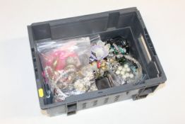 A box containing a large quantity of costume jewel