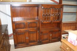 A leaded glazed linen fold decorated cabinet and a