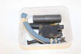 A small telescope, a Trench Art cannon, a Victoria