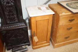 A stripped pine marble topped pot cupboard
