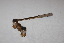 A pair of gilt metal and mother of pearl opera gla