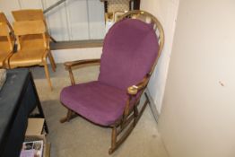 A mahogany stick back rocking chair