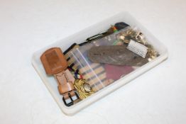 A box of mixed badges buttons etc.